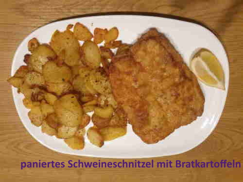 paniertes Schweineschnitzel mit Bratkartoffeln